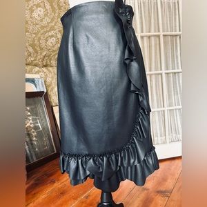 Adorable faux-leather flounced skirt.